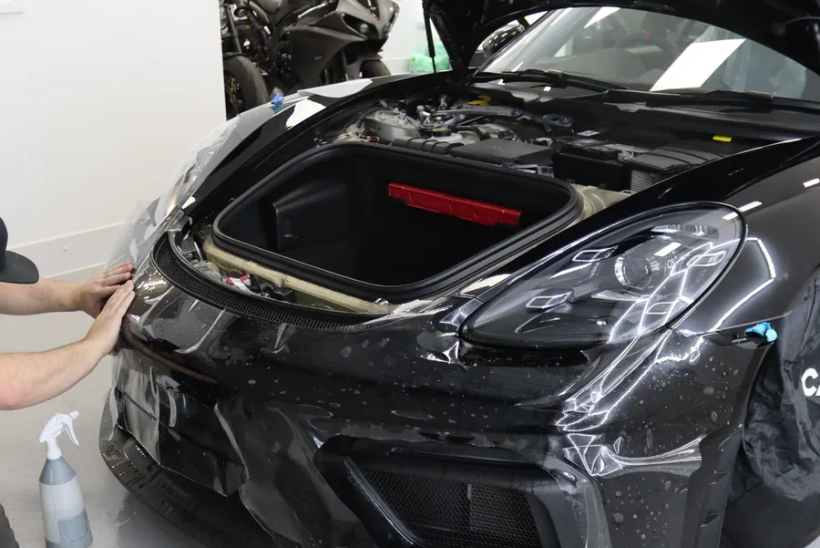 Paint protection film being fitted to a Porsche