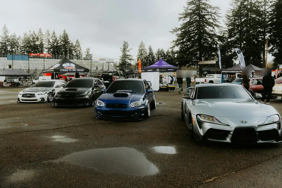 Cars lined up at a car meet